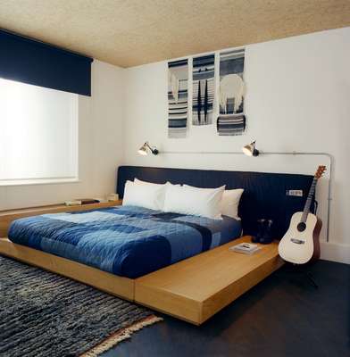 Bedroom in the suite; late-night guitar strumming is optional