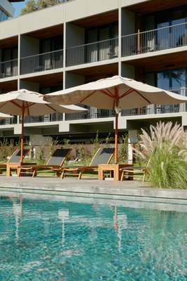 Deck chairs overlook the hotel’s pool