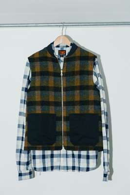 Checked-wool gilet over a patchwork shirt 