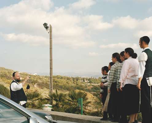 A Jewish man photographs his family at the Israel-Lebanon border, Rosh ha-Nikra