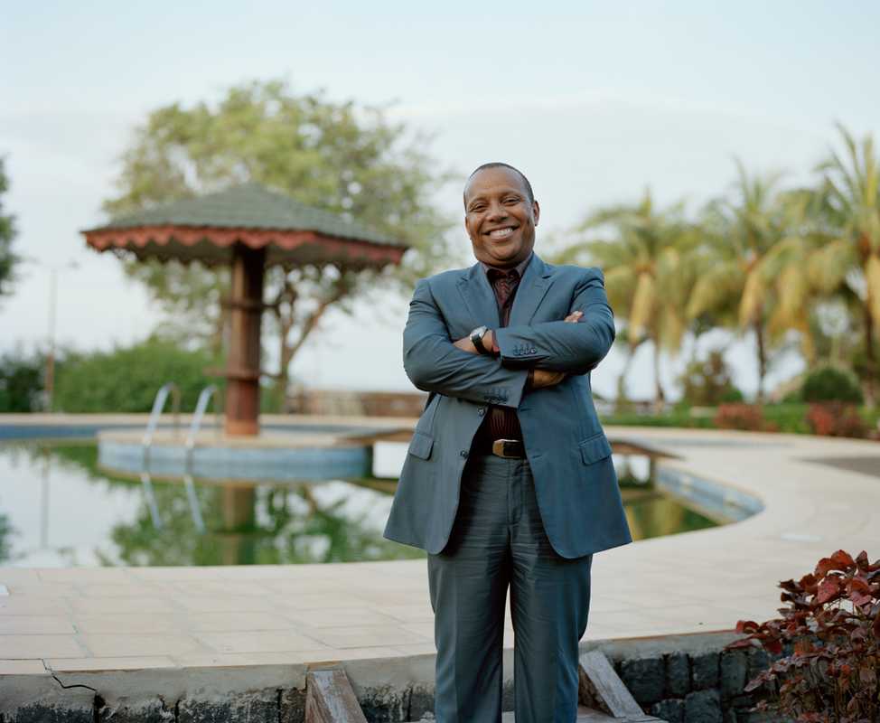 Prime minister Patrice Trovoada in the botanical gardens of his beachside villa 